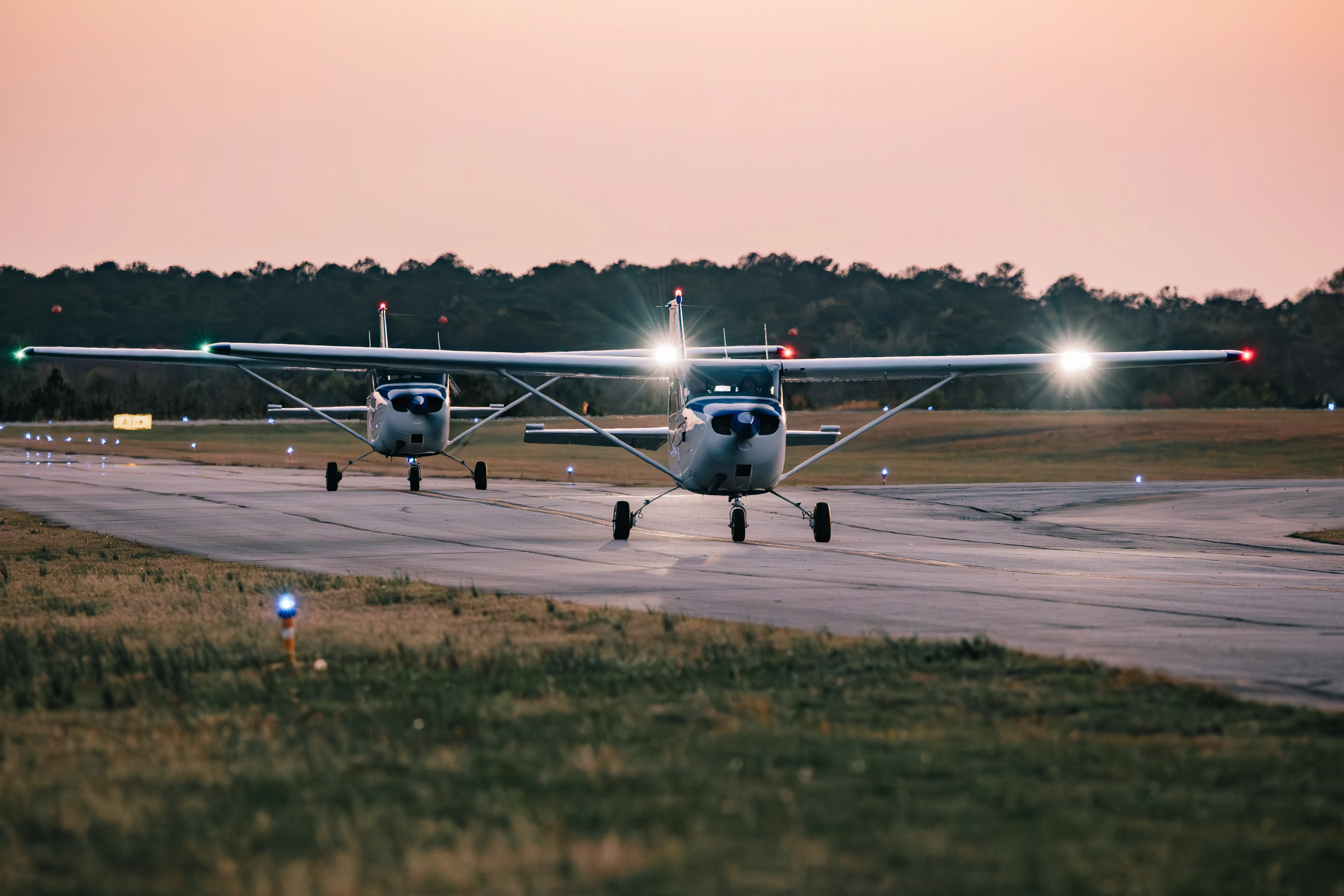 Speedway Flight Training instructors and staff in front of a Cessna at KHMP