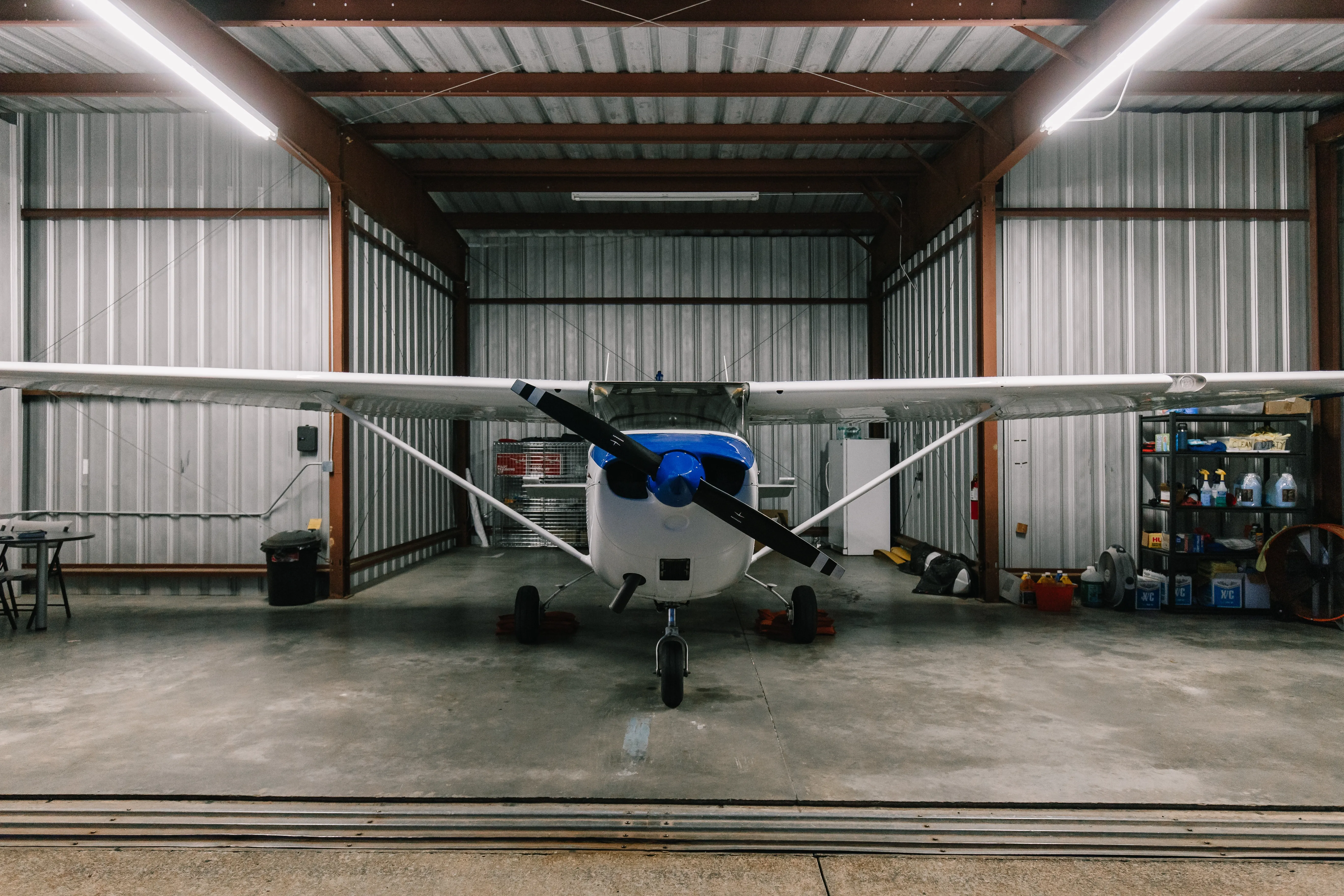 Speedway Flight Training student pulling plane out of hangar