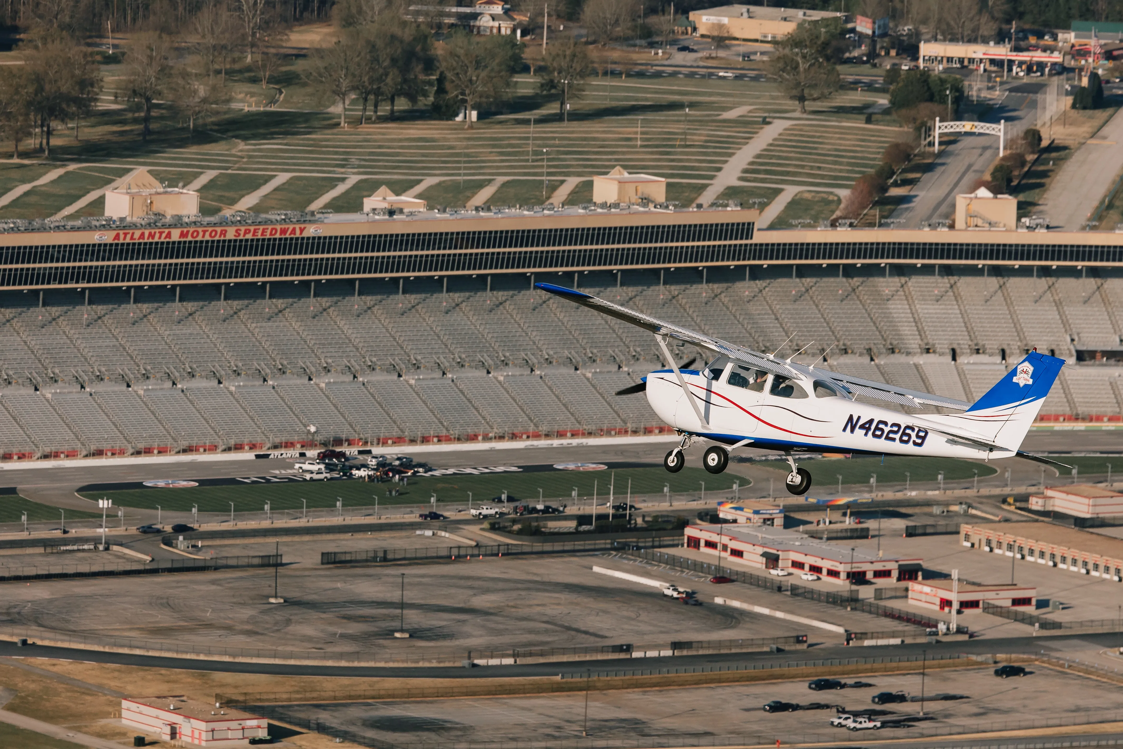 Speedway Flight Training instructors and staff in front of a Cessna at KHMP