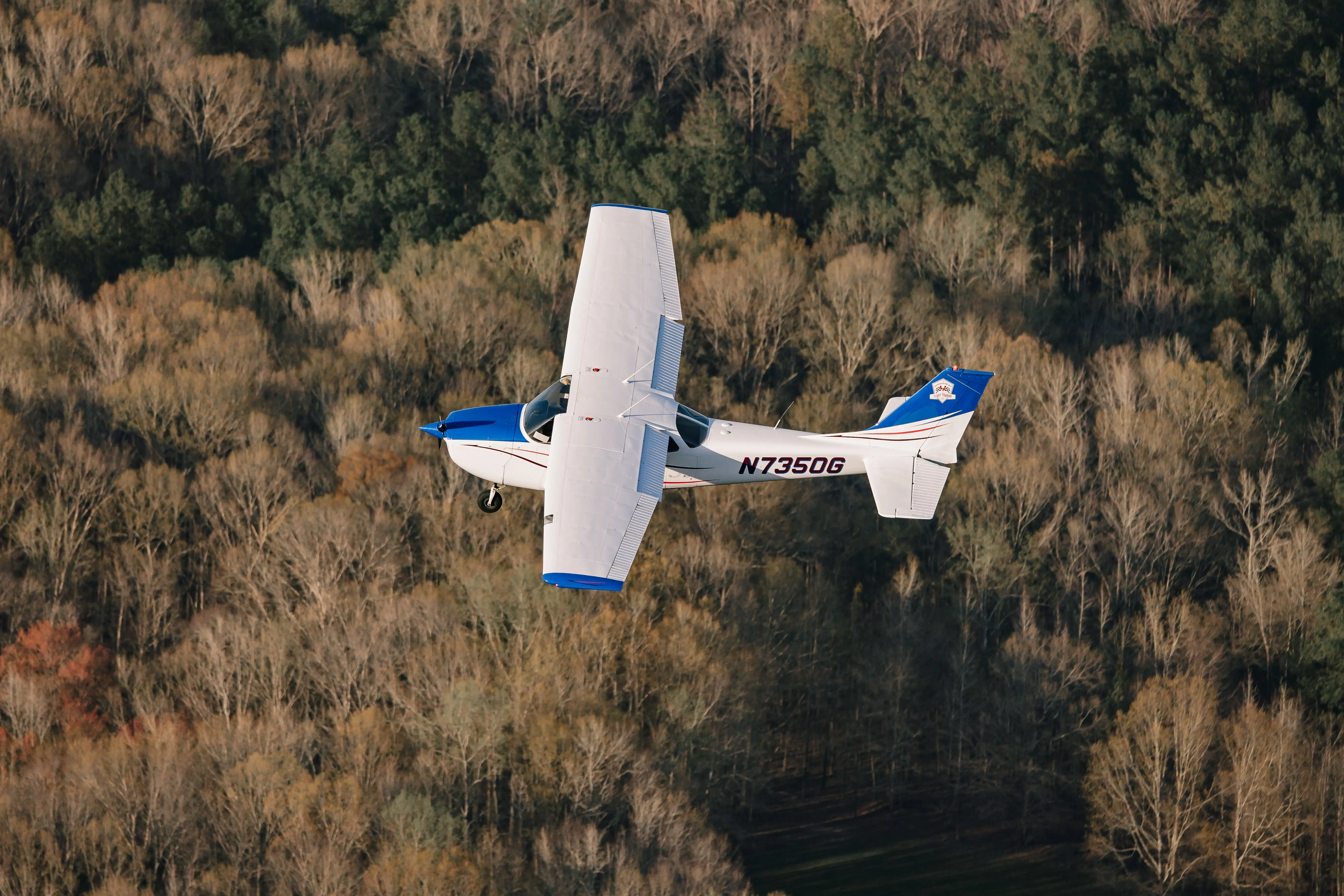 Flight instructor performing spin recovery maneuver