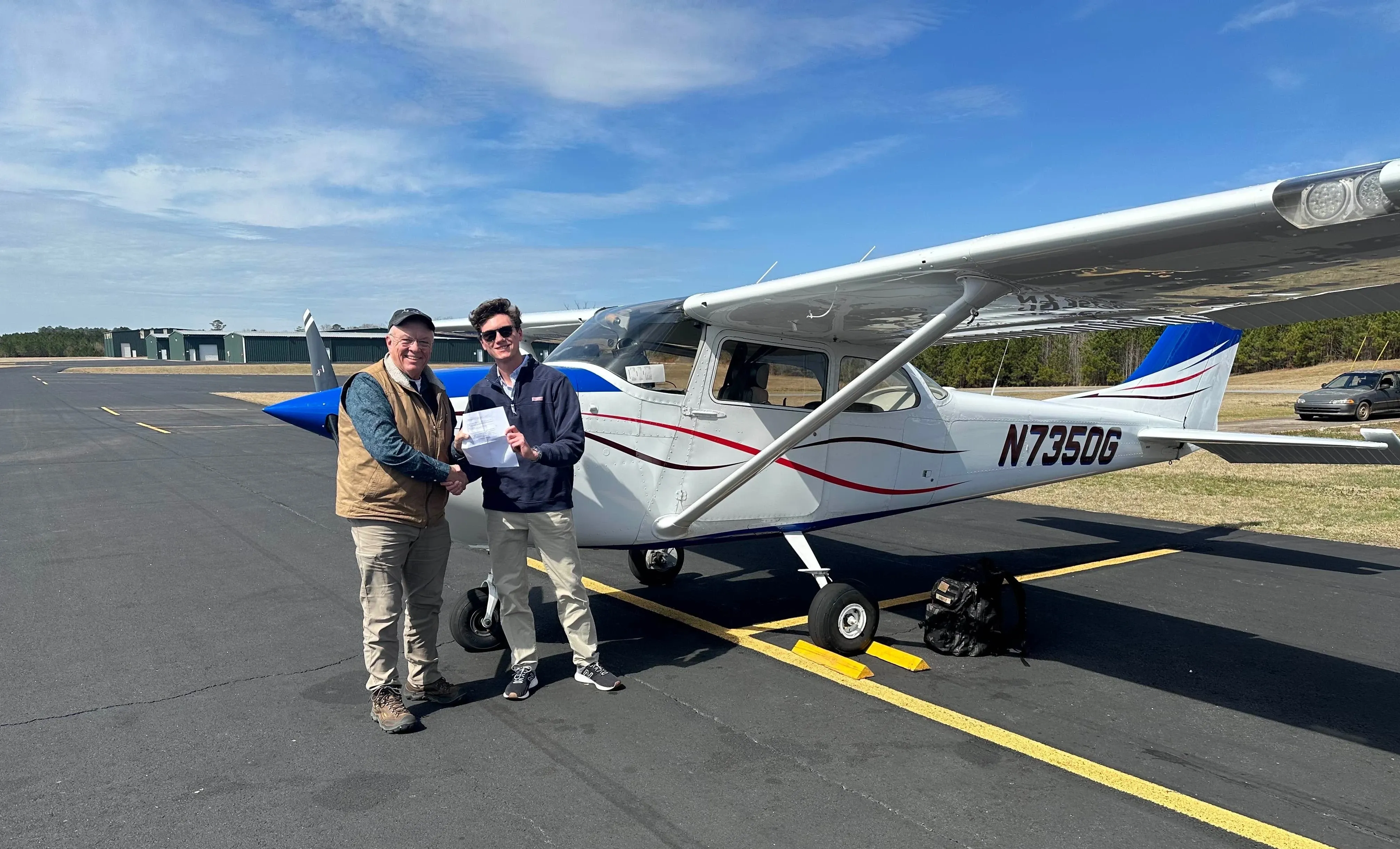 Speedway Flight Training instructor guiding a student pilot
