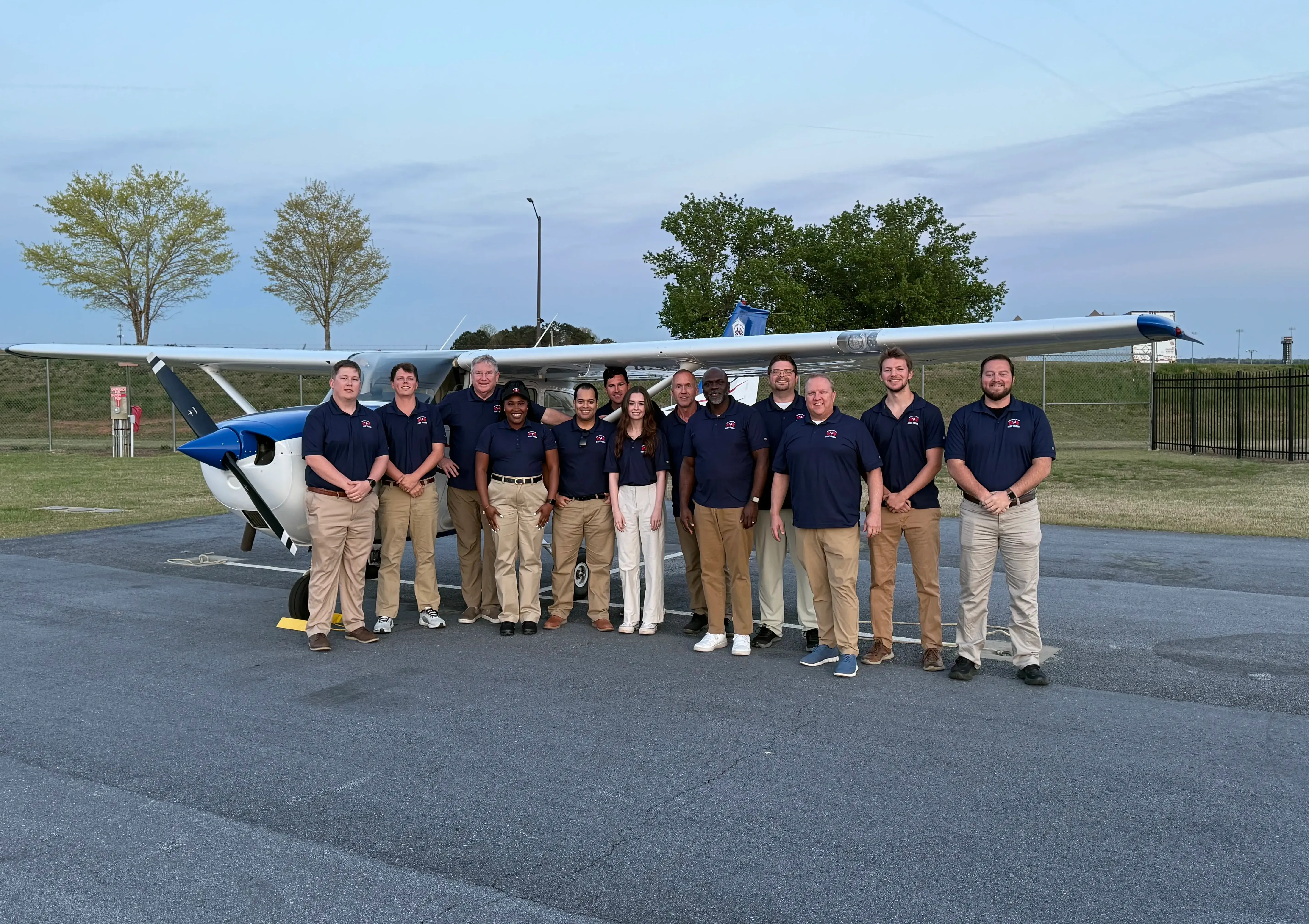 Speedway Flight Training instructors and staff in front of a Cessna at KHMP