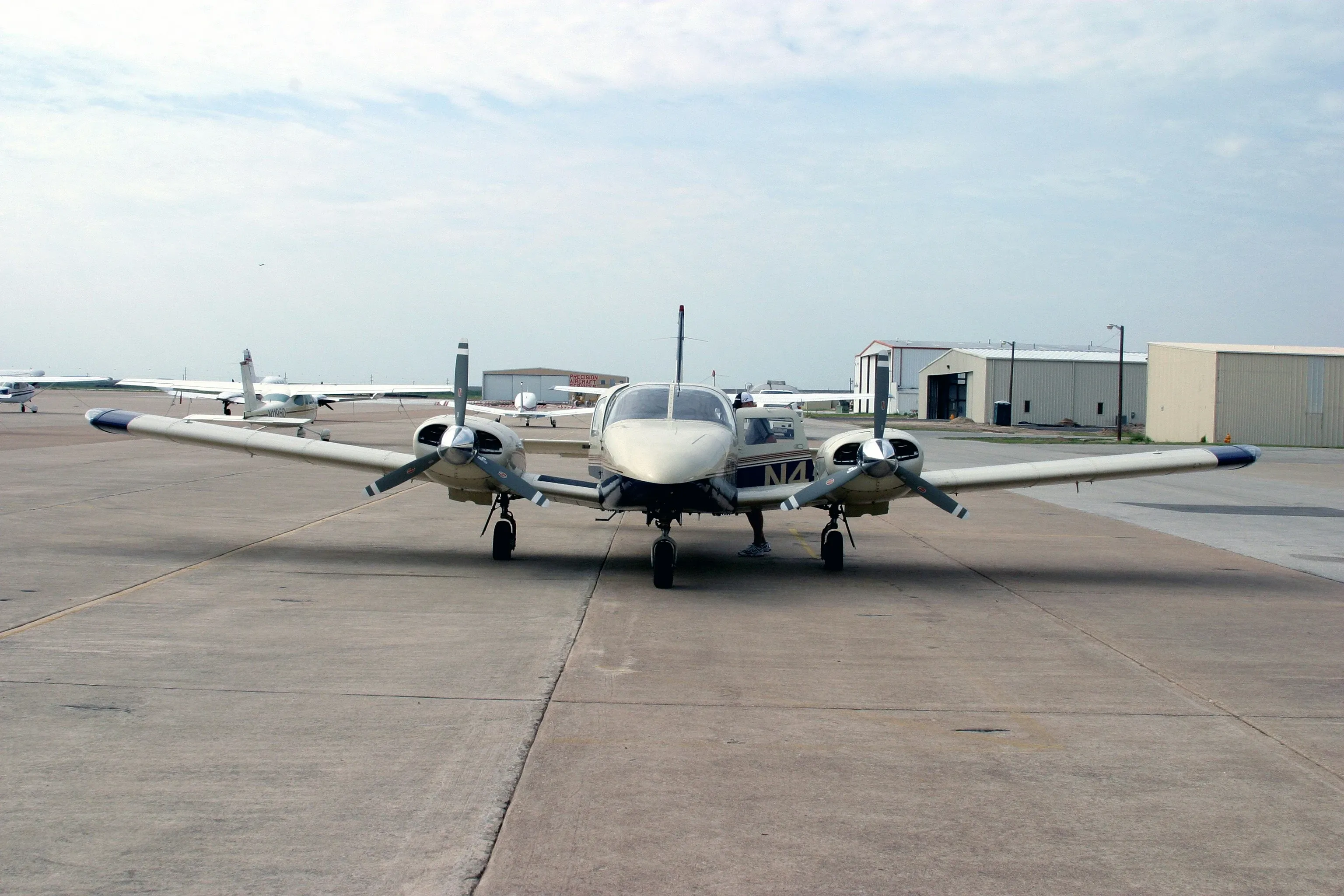 Instructor briefing a multi-engine flight student on the tarmac