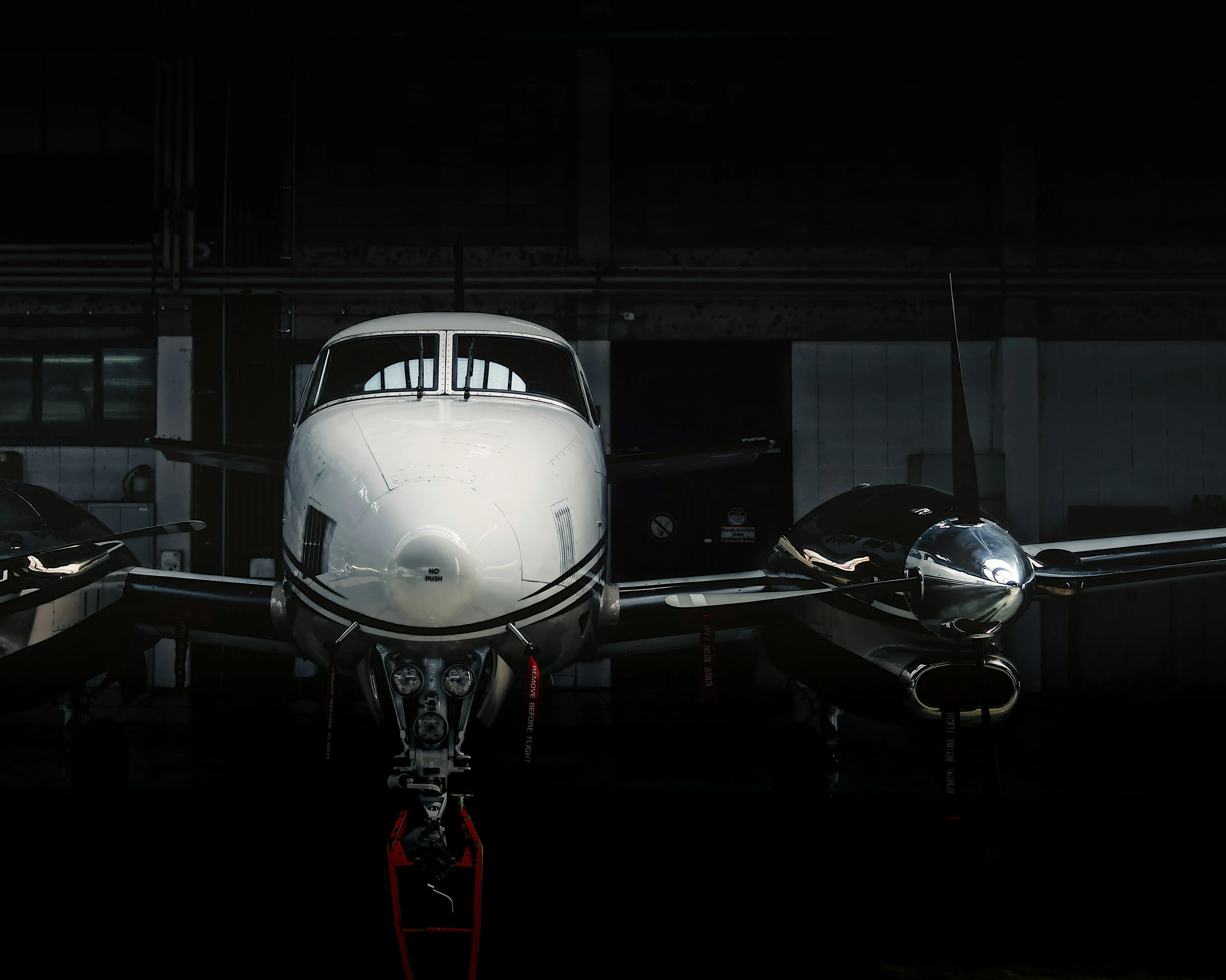 Instructor and student walking toward a multi-engine aircraft