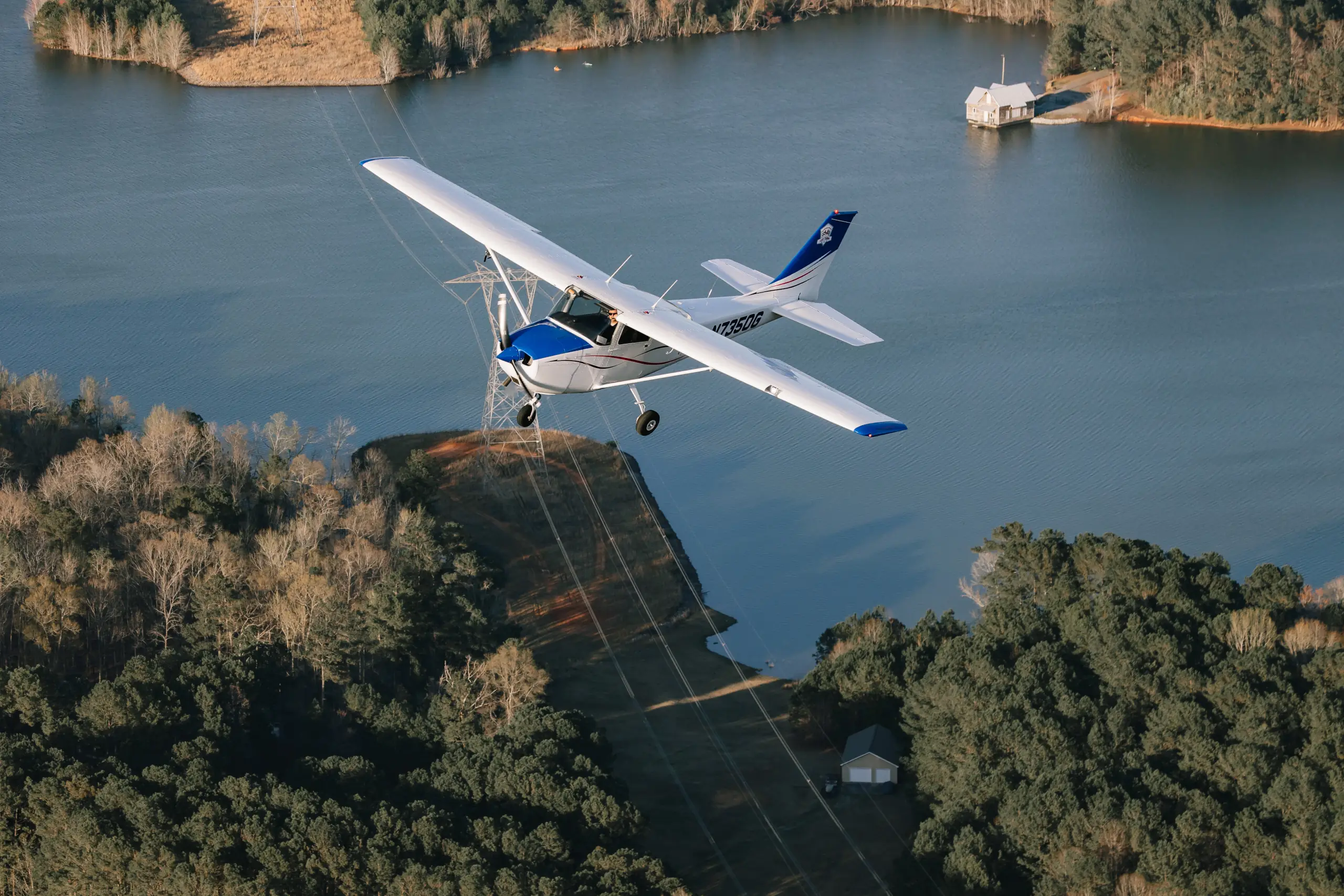 Airplane flying over Cole Reservoir near Hampton, Georgia