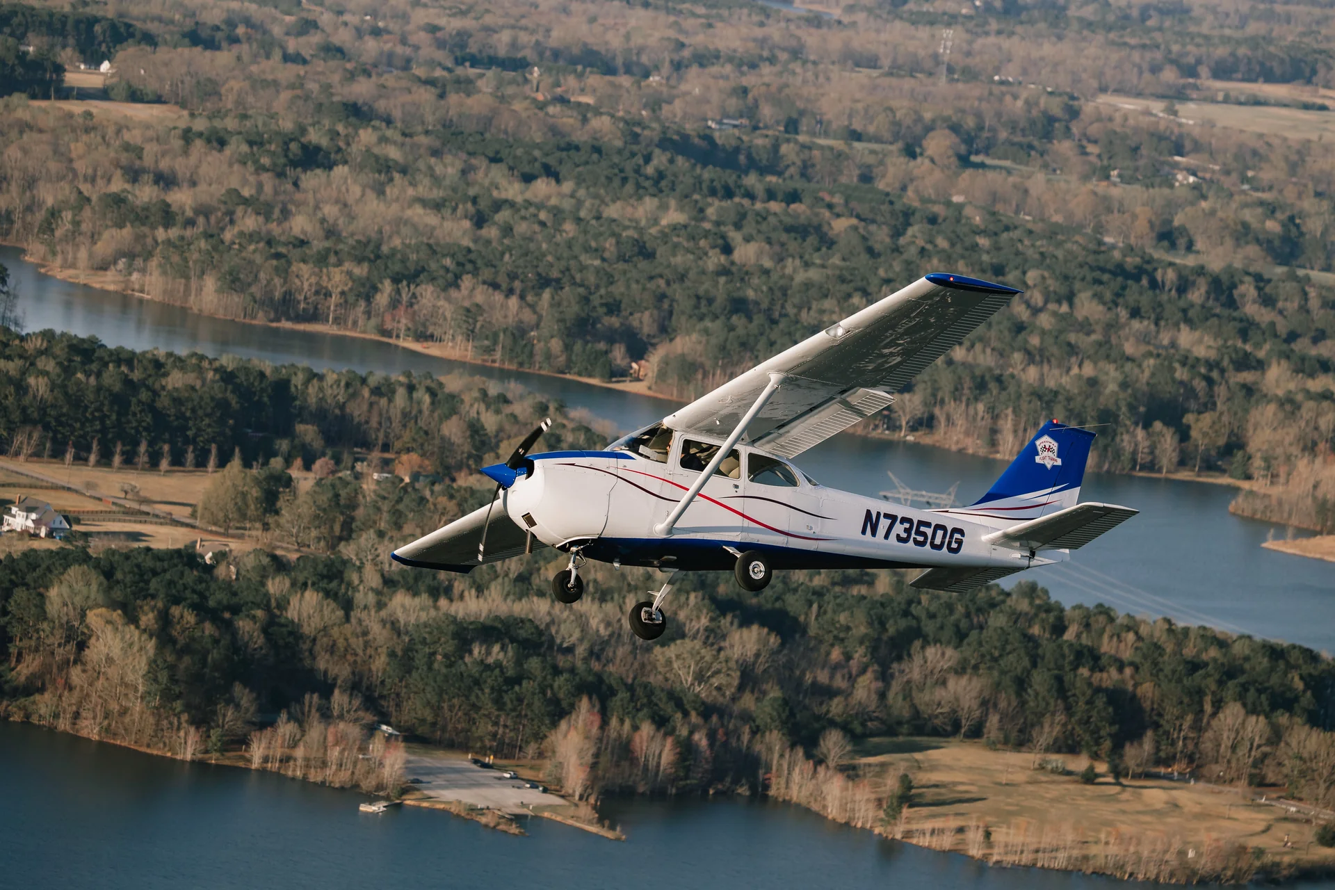 Cessna 172 flying over Georgia lakes and forests near Hampton