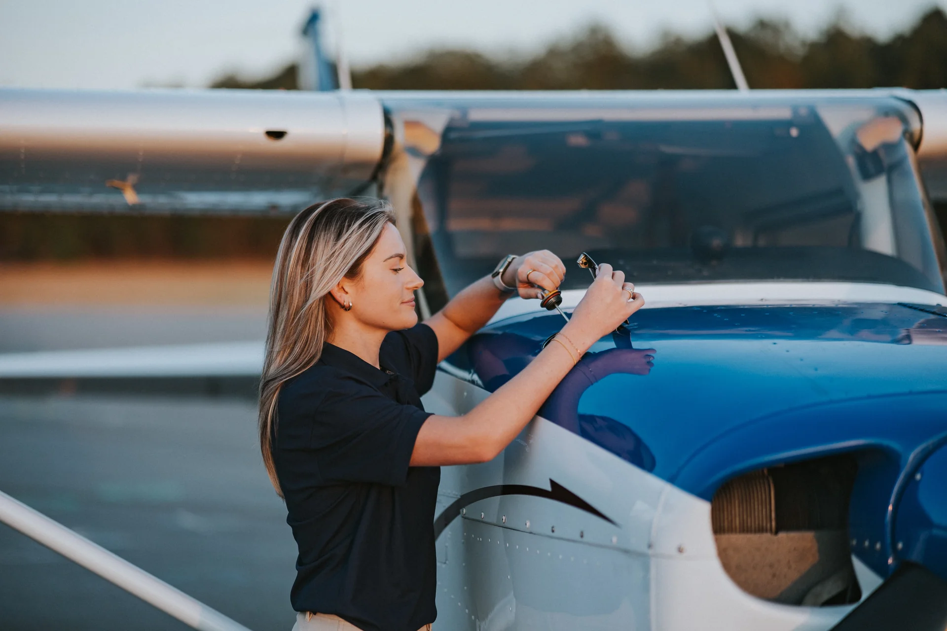 A student pilot doing a preflight check on a Cessna 172 at Atlanta Speedway Airport